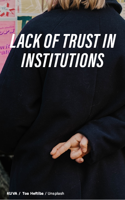 A person seen from behind, wearing a black coat, crossing their fingers behind their back. The phrase "LACK OF TRUST IN INSTITUTIONS" overlays the image in large white text. Photo by Toa Heftiba on Unsplash.