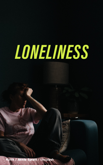 A somber woman seated in a dark room with a lamp in the background, her hand resting on her forehead. The word "LONELINESS" is prominently displayed in bright yellow letters. Photo by Annie Spratt on Unsplash.